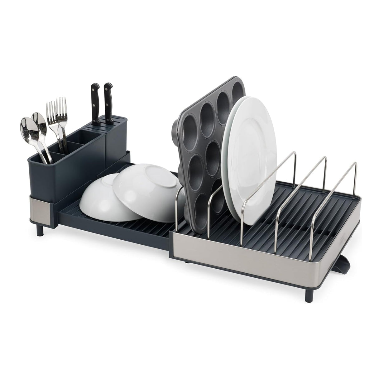Escurridor de platos expandible de acero negro con utensilios, platos y moldes de muffins, vista frontal